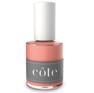 Cote nail polish in light and creamy coral pink