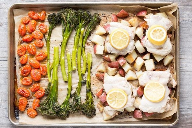 image of gluten-free sheet pan recipe- tomatoes, broccolini, and lemon thyme chicken, spaced out on ...
