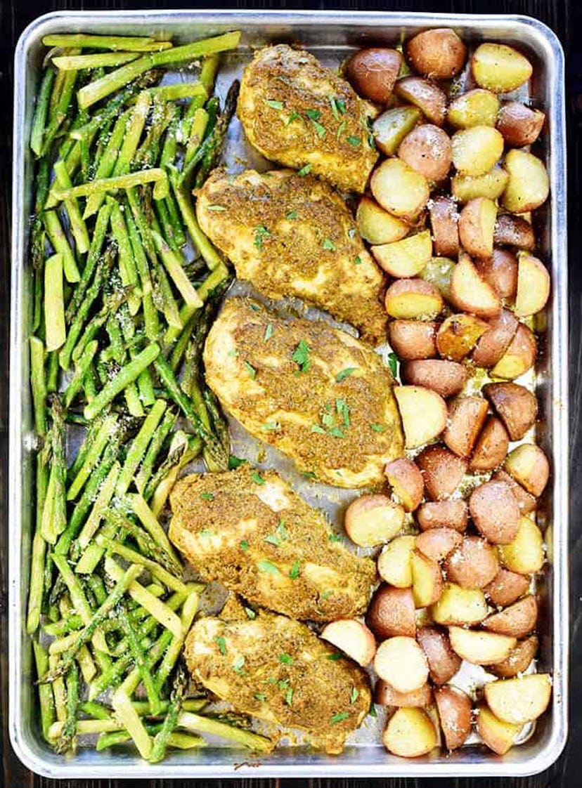 gluten-free sheet pan recipe featuring pesto chicken and vegetables, shot from above