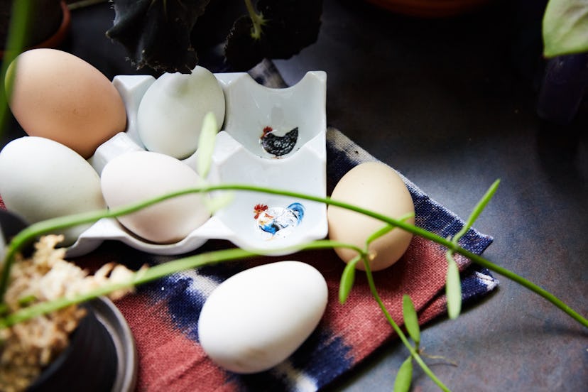 A ceramic egg holder with illustrated roosters in Summer Rayne Oakes' home