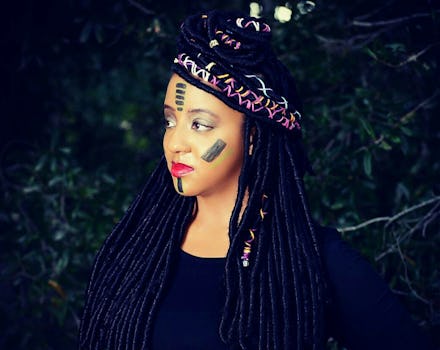 A black woman with face paint
