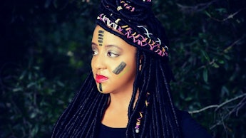 A black woman with face paint 