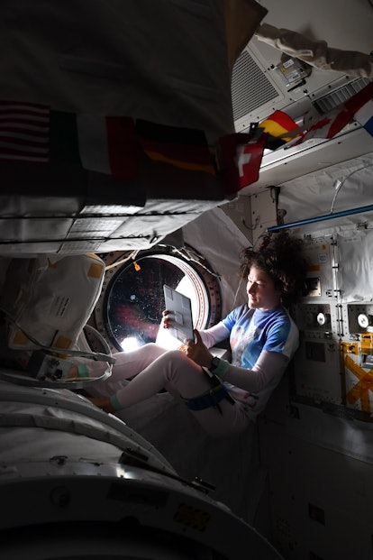 Christina Koch using a tablet in her out-of-this-world home