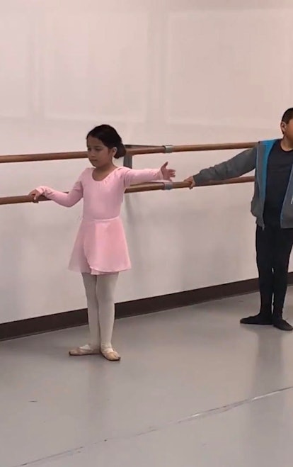 A little girl at ballet training