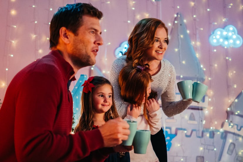 Sarah Drew, Ryan McPartlin and Cleary Herzlinger laughing in a scene in Twinkle All The Way 
