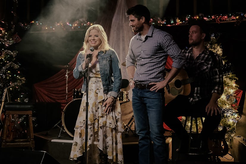 Megan Hilty as Laney in Sweet Mountain Christmas, singing on stage with Marcus Rosner as Robbie besi...