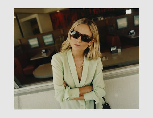 Marisa Hordern, founder and creative director of London-based jewelry brand Missoma in a white dress...