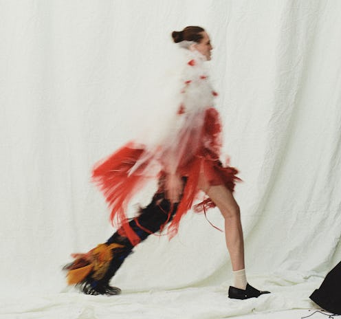 A model walking in a white, red, and black tulle outfit, from one of the 6 new brands at the NYFW