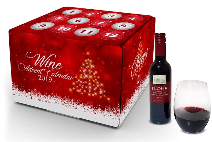A 2019 wine and champagne advent calendar next to a bottle and glass of red wine