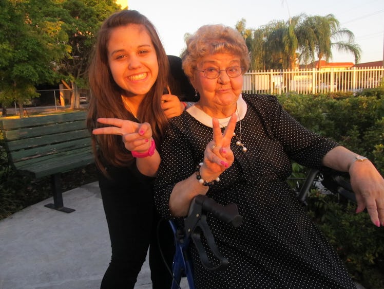 Paola De Varona and her grandmother posing together in a park