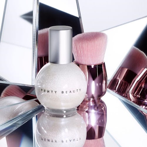 Fenty Beauty products placed in front of two mirrors