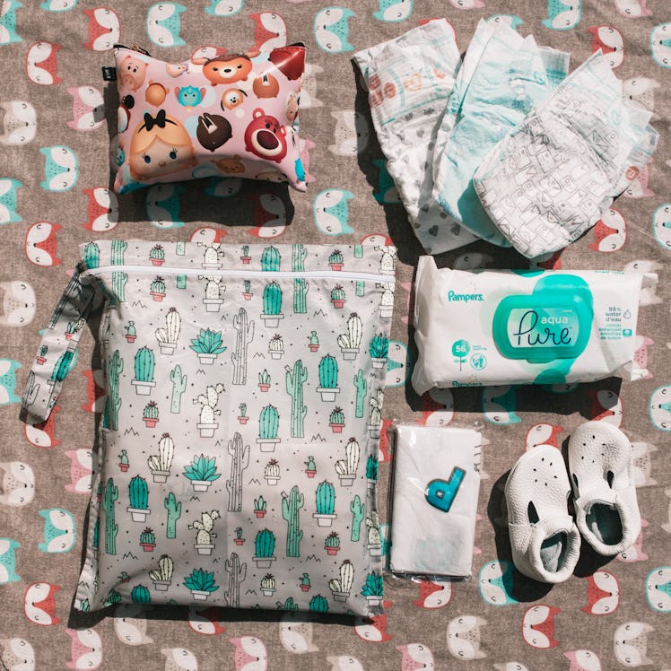 Slippers, wet wipes, diapers and two makeup bags from a mom's bag 