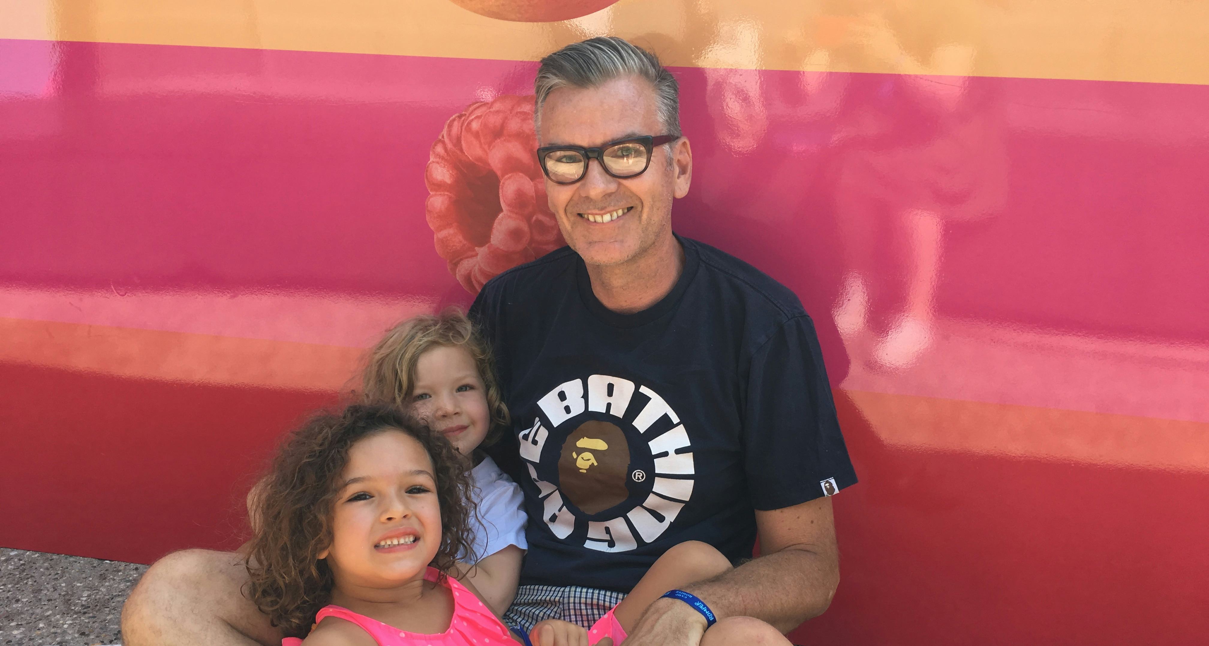 A dad and his two daughter at Camp Romper