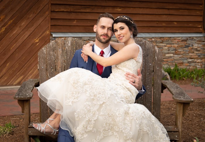 Matt holding Amber From 'Married At First Sight' while she is wearing her wedding dress