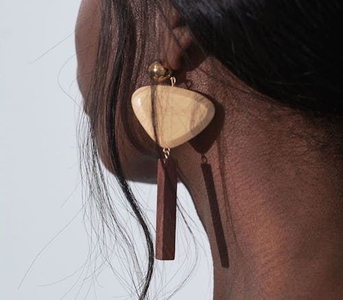 A woman having a Sophie Monet Jewelry earring on left ear