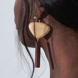 A woman having a Sophie Monet Jewelry earring on left ear