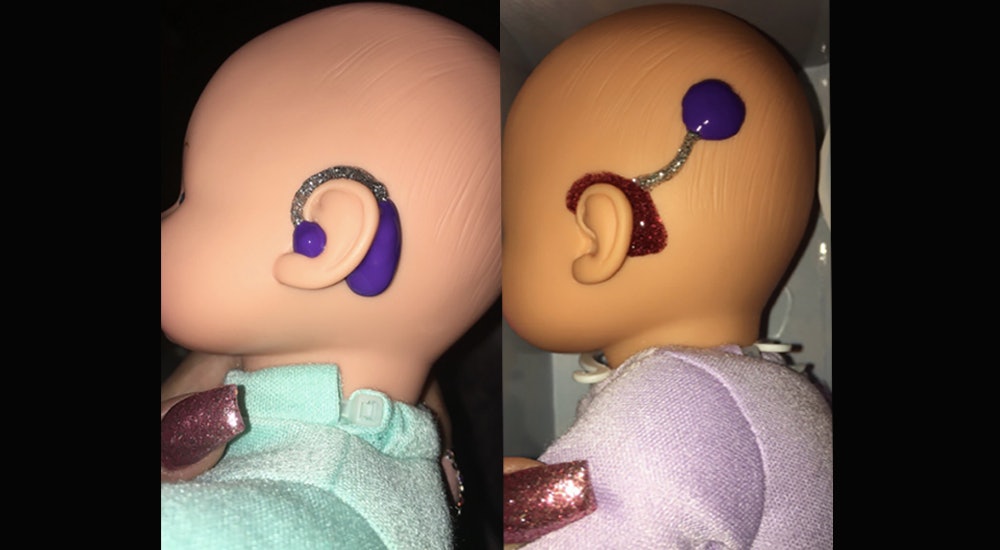 baby doll with cochlear implants