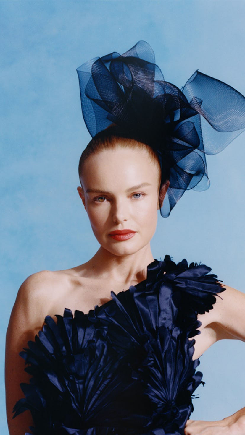 Kate Bosworth poses in the Oscar de la Renta dark blue gown and a matching headpiece.