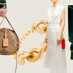 A white asymmetric pleated satin dress, a Louis Vuitton bag, an oversized links choker and black lea...