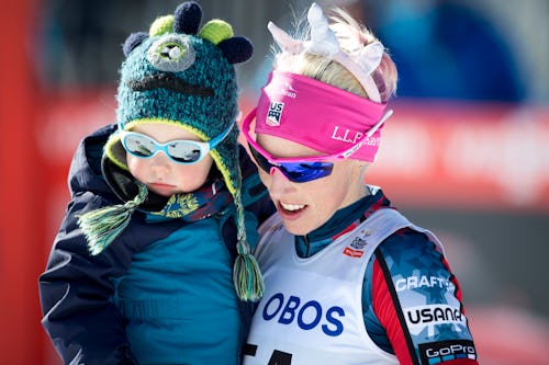 Kikkan Randal of USA with her son after Ladies 10.0 km Pursuit Free
