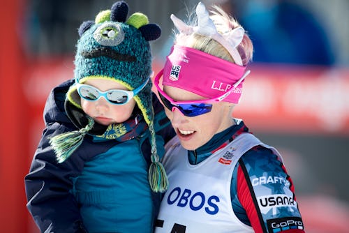 Kikkan Randal of USA with her son after Ladies 10.0 km Pursuit Free