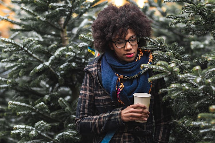 Young Black woman in snowy scene