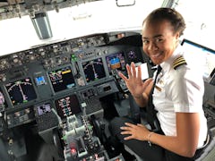 Monique Grayson, a pilot for Delta Airlines, sits in the flight deck of an aircraft.