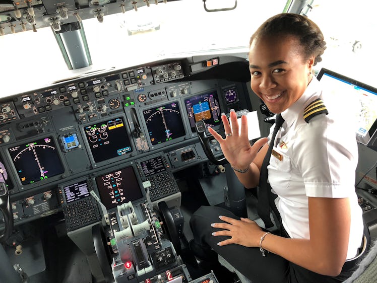 Monique Grayson, a pilot for Delta Airlines, sits in the flight deck of an aircraft.