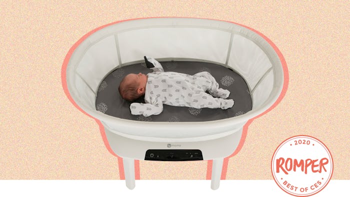 a baby in a 4moms mamaroo sleep bassinet