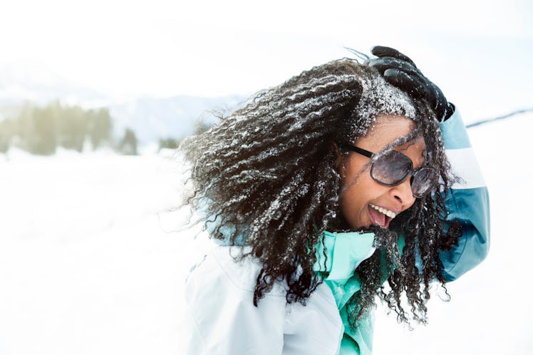 Young Black woman with snow in her hair