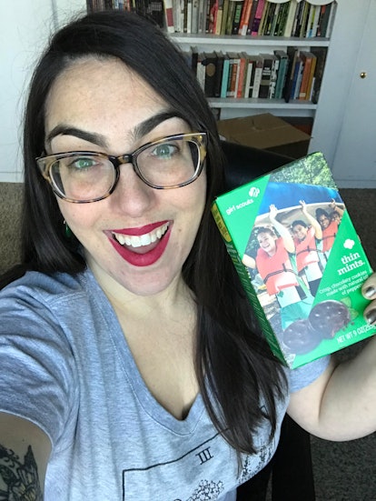 The author holds a box of girl scout cookies