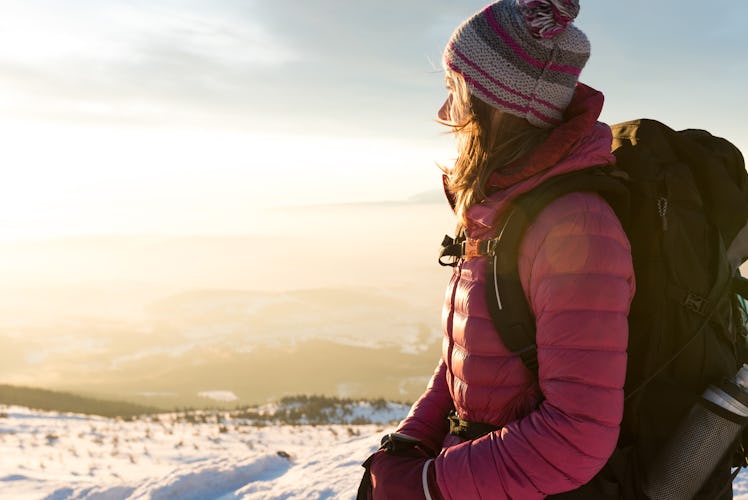 Young woman on snowy mountain