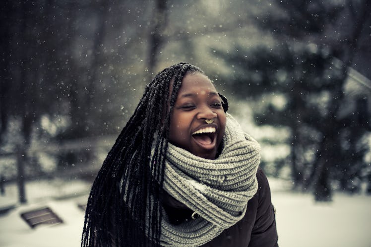 Young Black woman enjoying the snow