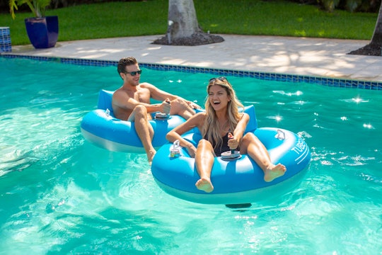 a man and woman in poolcandy motorized pool floats
