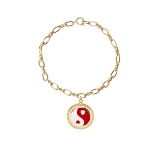 Wilhemina Garcia's gold yingyang red bracelet. 