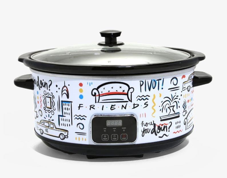An image of a white slow cooker with doodles featuring quotes from the show 'Friends' upon it. 