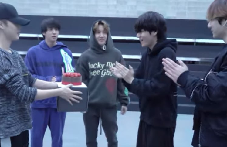 A screenshot from the video of BTS' surprise party for V's 24th birthday.