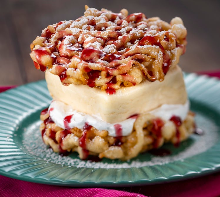 The Peanut Butter and Jelly Funnel Cake served at Epcot's International Festival of the Arts sits on...