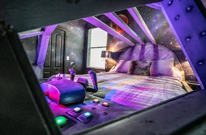 The bed in a 'Star Wars'-themed Airbnb lights up with a spaceship console and has galaxy-painted wal...