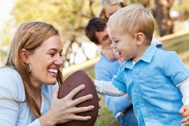 Mother and child with football.