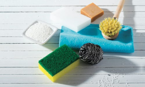 Three sponges, powder, a metal thread sponge, a brush, a small soap bar for washing dishes