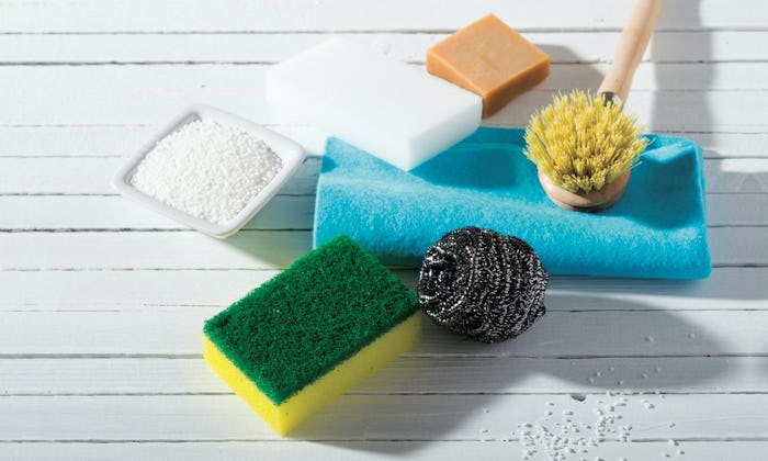 Three sponges, powder, a metal thread sponge, a brush, a small soap bar for washing dishes