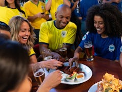 Football fans eating snacks during Super Bowl