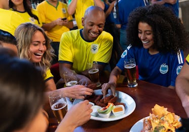 Football fans eating snacks during Super Bowl