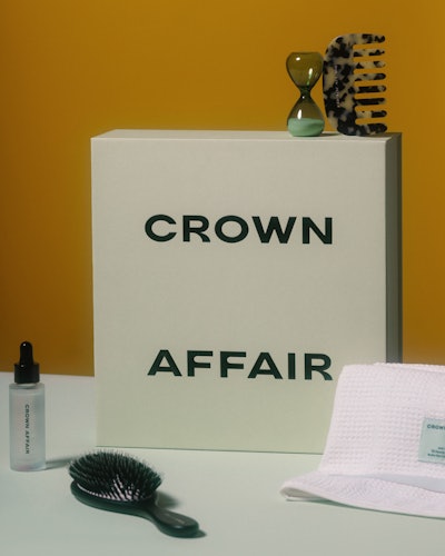 Brush, combs, oil, and towel from new haircare brand Crown Affair.