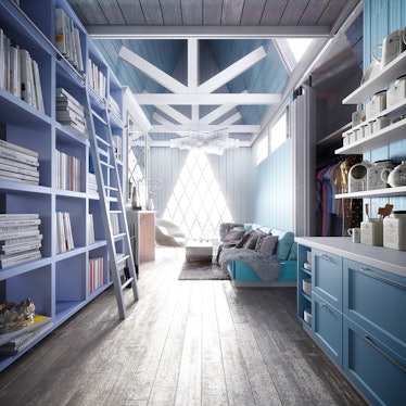 A ladder leans against a blue bookshelf in an Elsa-inspired Disney tiny home. 