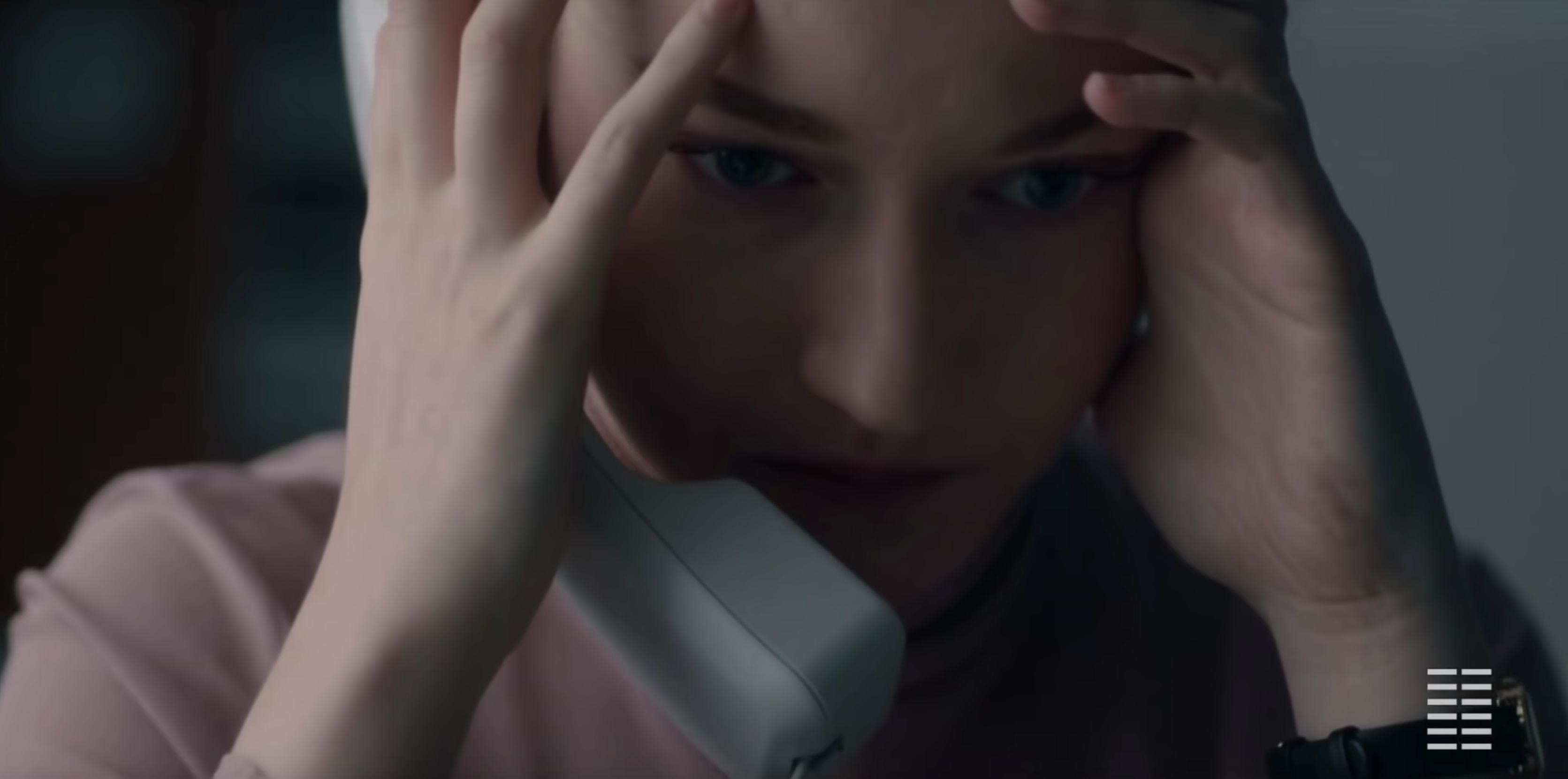 Julia Garner holding a telephone in 'The Assistant'