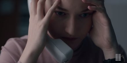 Julia Garner holding a telephone in 'The Assistant'