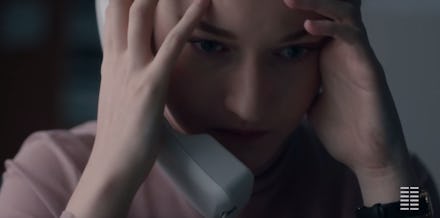 Julia Garner holding a telephone in 'The Assistant'