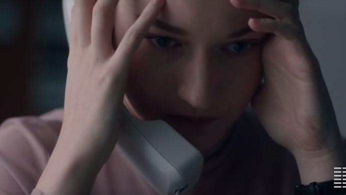 Julia Garner holding a telephone in 'The Assistant'